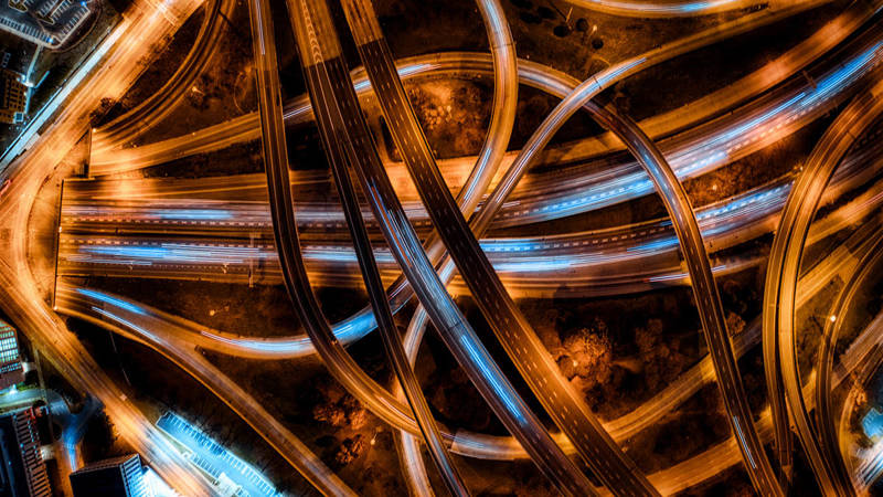 Complex motorway junction at night from above