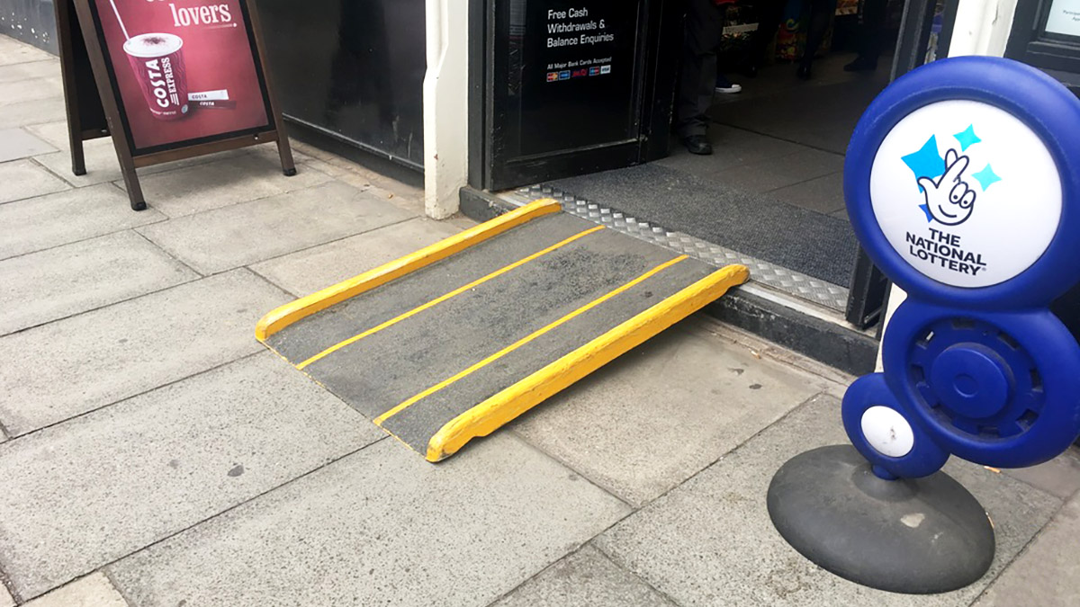 A small ramp on the step into a shop