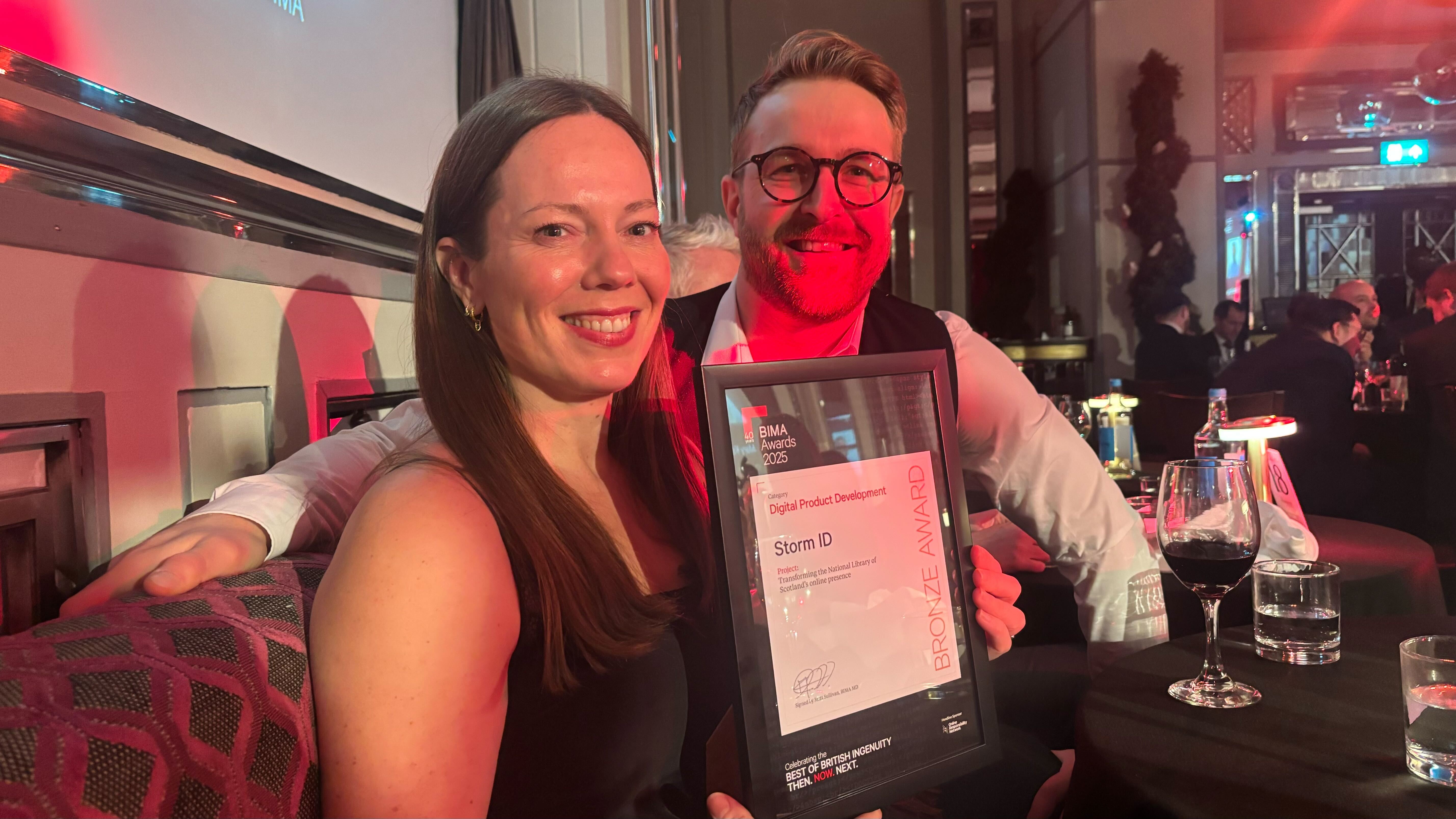 Linsey Lydon and Mike Cashin collect the BIMA Award for Storm ID's work with National Library of Scotland 