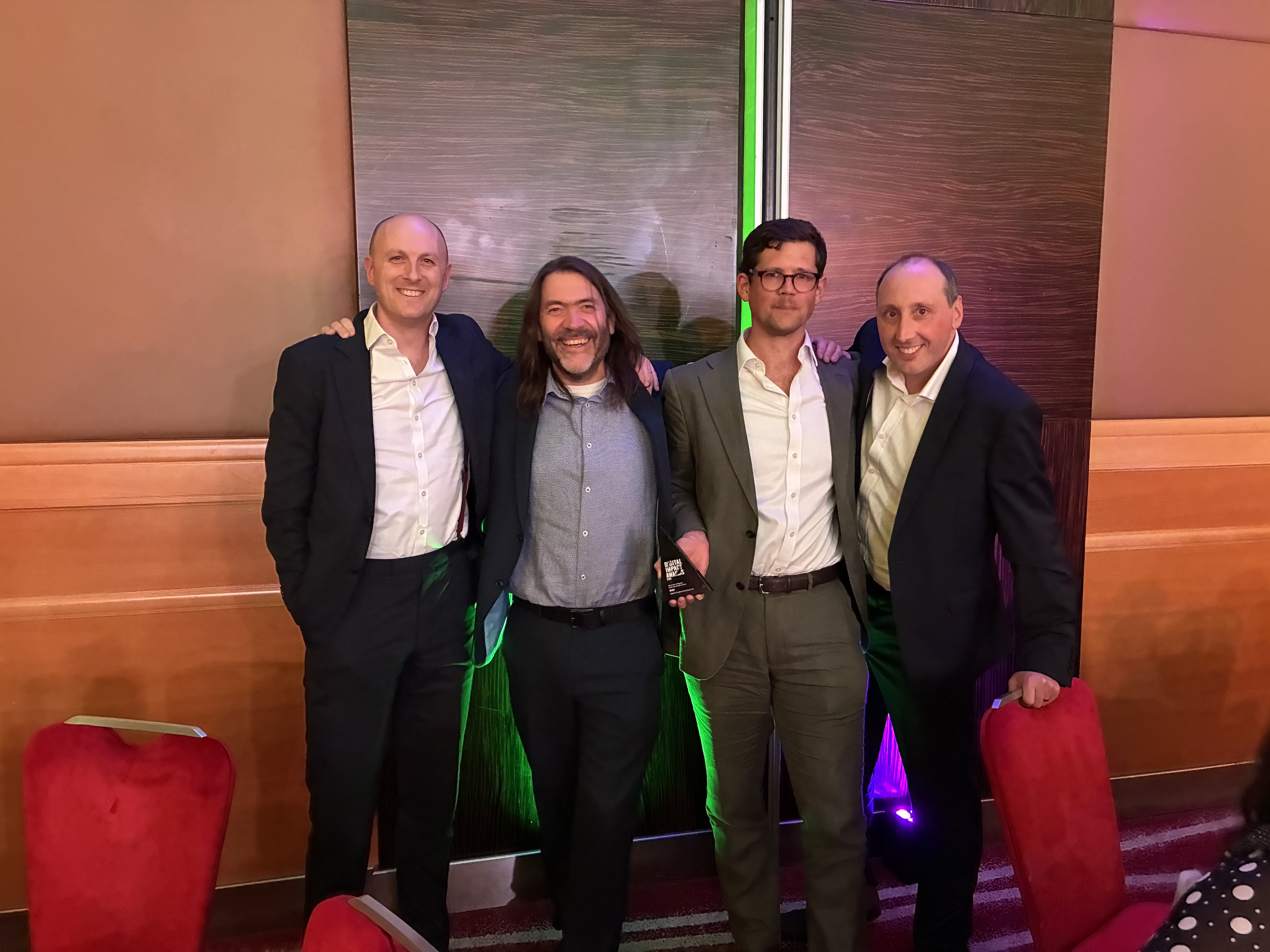 The team from Historic England and Storm ID celebrating the win at the Digital Impact Awards in London