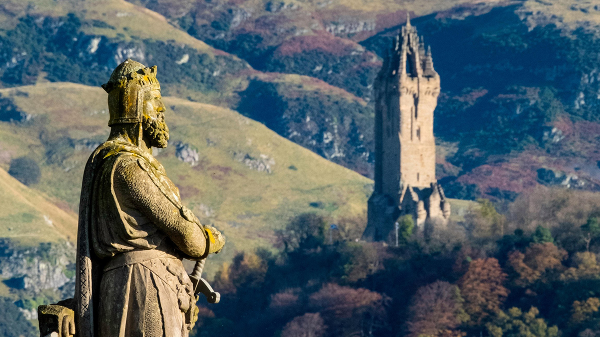 View of Stirling Castle in the distance with Wallace Monument in the foreground